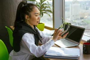 a woman looking at a laptop